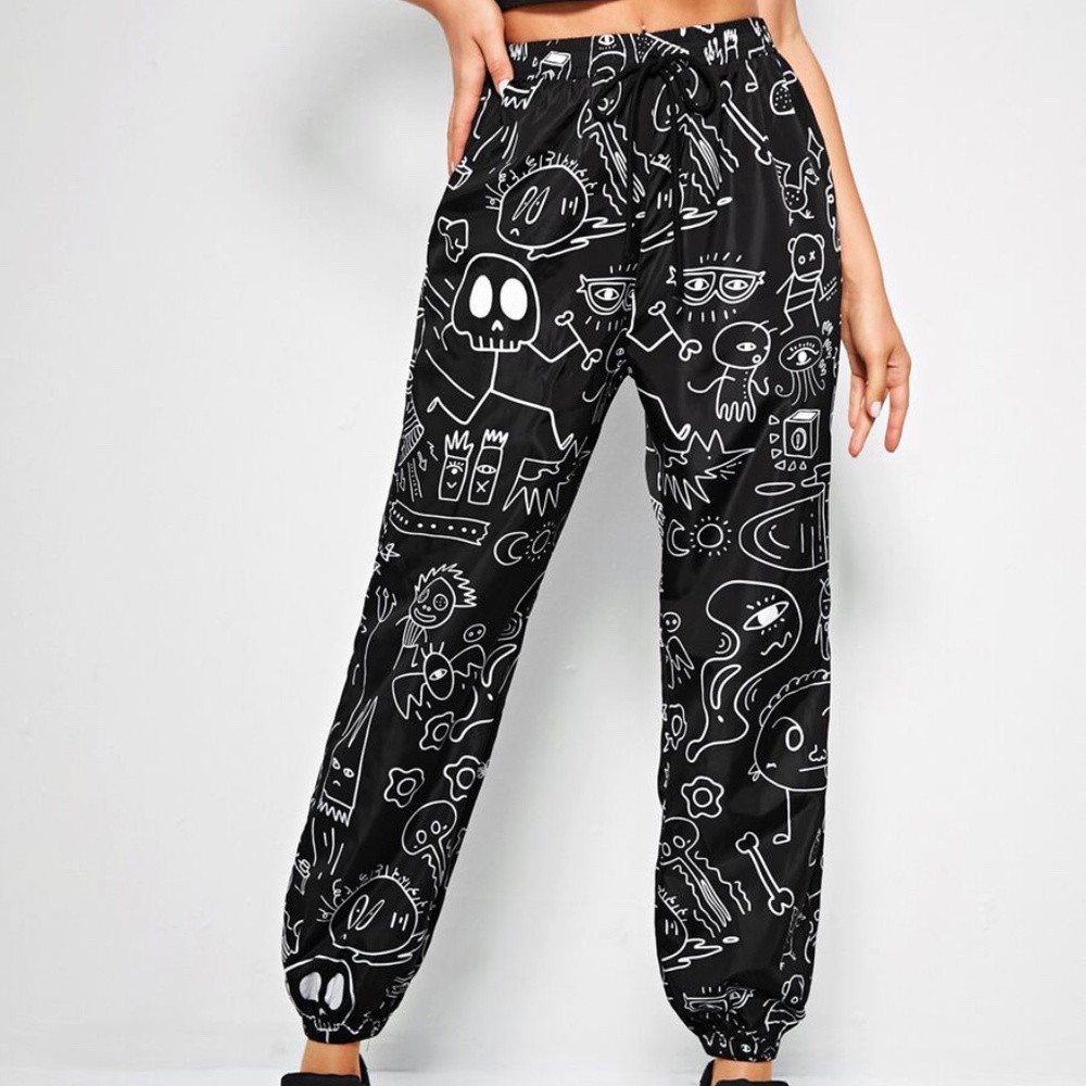 black and white allover cartoon wind breaker pants